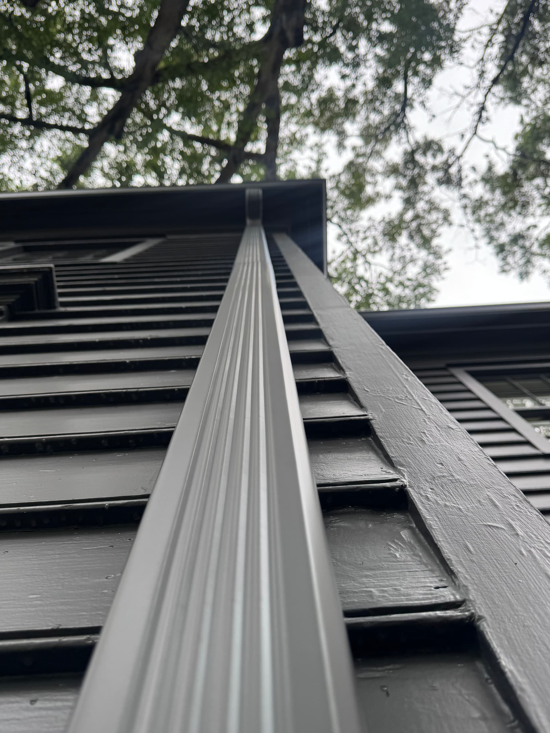 Gallery photos for Tuxedo Gray Gutter Installation on a Sharp Two-Story Home: Image #1