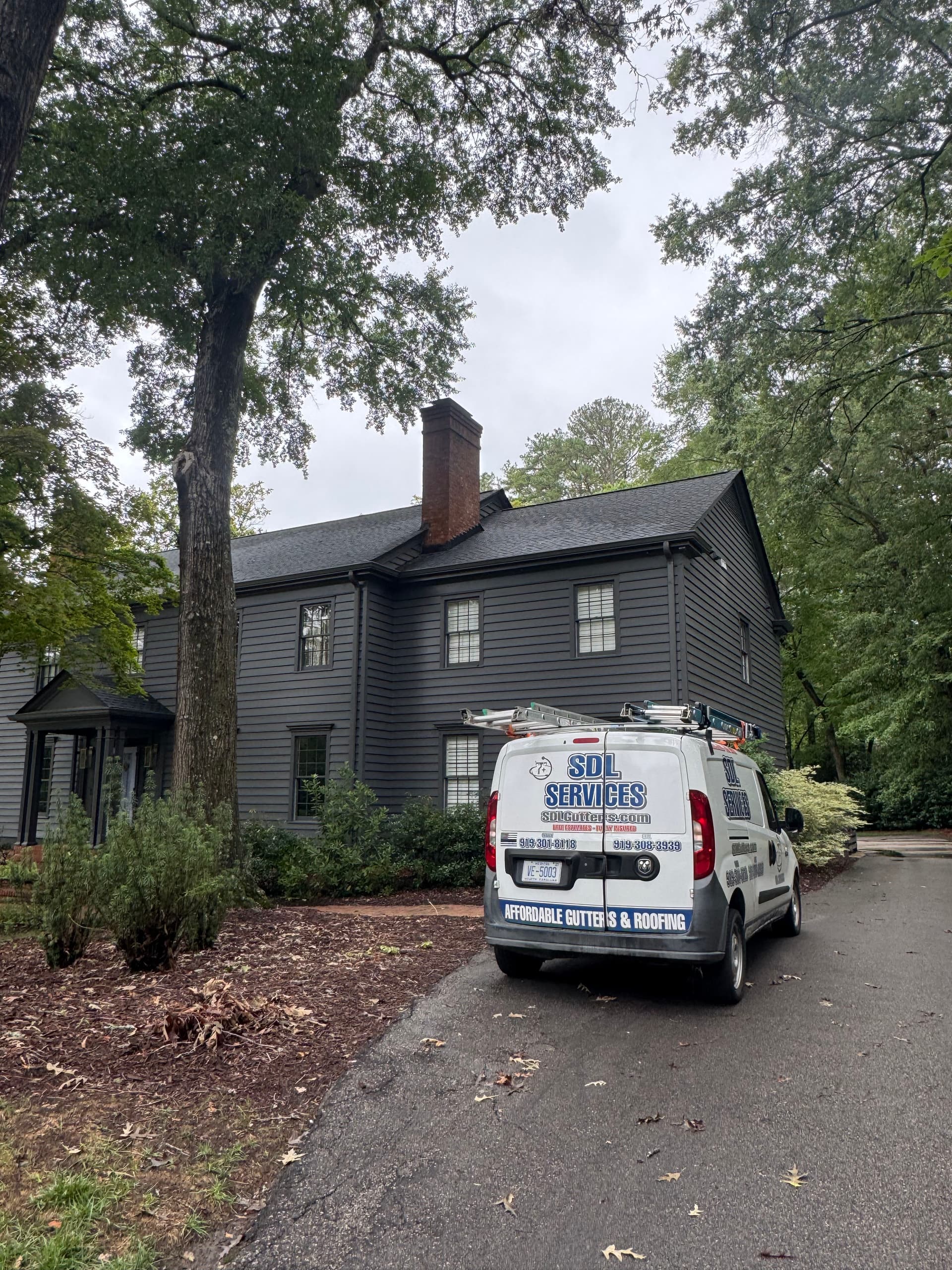 Gallery photos for Tuxedo Gray Gutter Installation on a Sharp Two-Story Home: Image #4